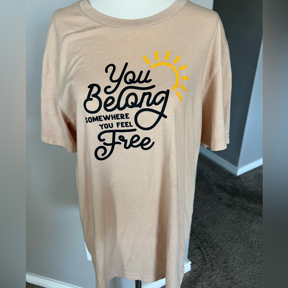 Tan color t-shirt. Tom Petty lyrics. You Belong Somewhere You Feel Free. Large.